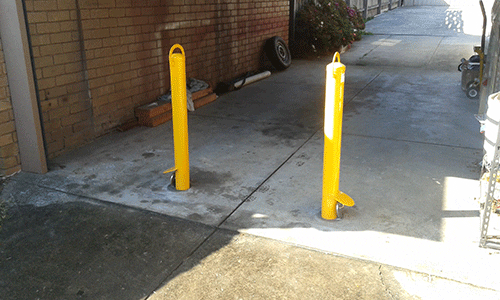 Two removable bollards installed in a driveway in Bayswater