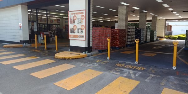 Removable bollards protecting BWS Bayswater from ram raids