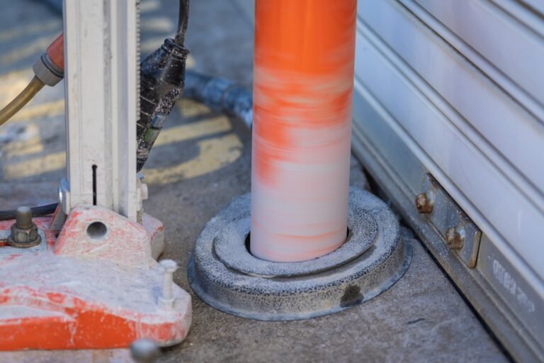 Core drilling a removable bollard sleeve hole in front of a roller door in Laverton North