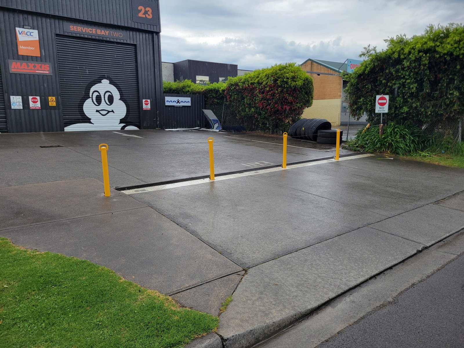 Removable bollards outside service bay two at Fast Freddies Tyre Service.