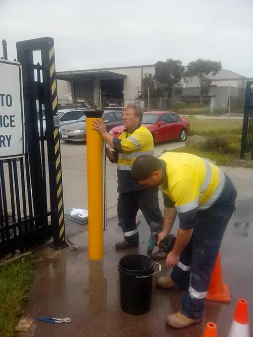 Finished bollard install protecting gates in Laverton